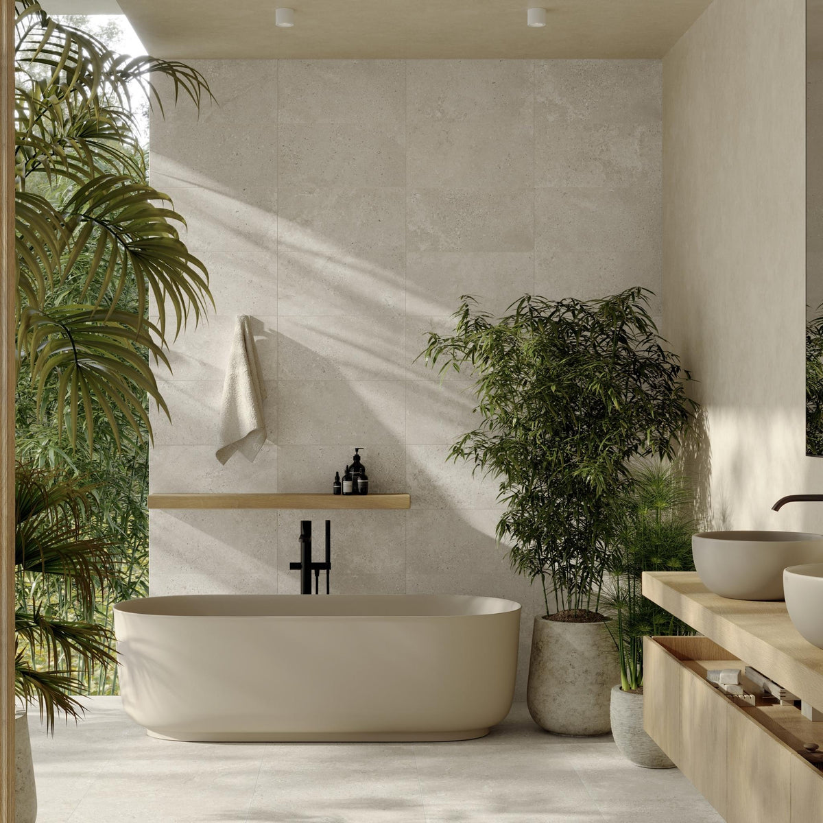Modern bathroom with alveria white stone effect wall and floor tiles, a freestanding bathtub, plants, and wooden shelves.
