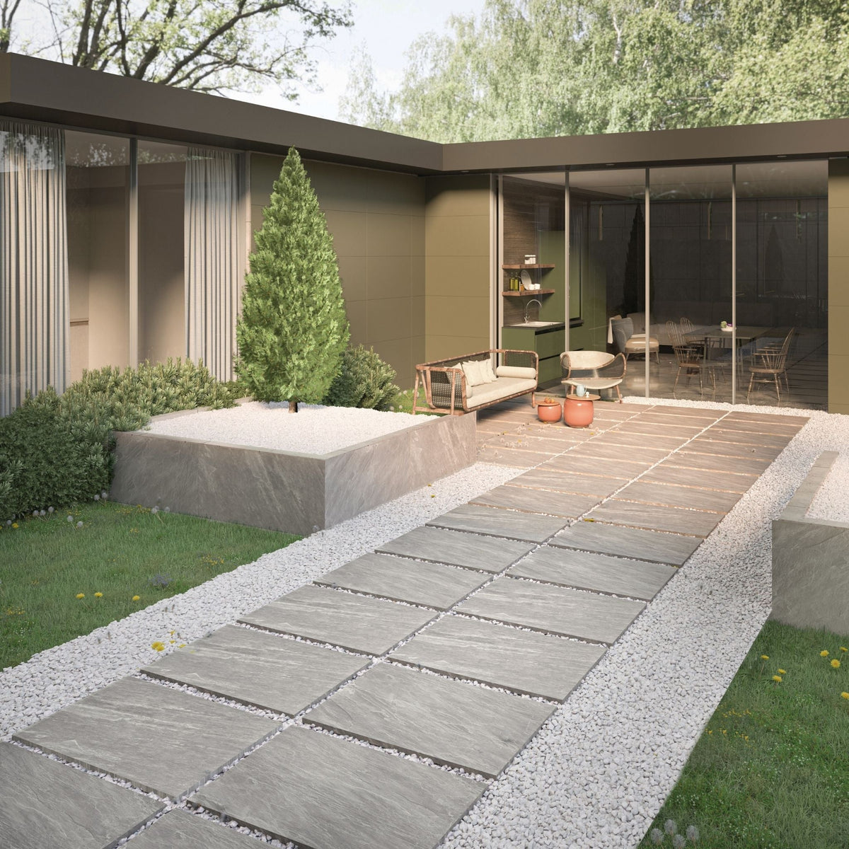 Modern outdoor patio area with a paved walkway Lottie grey outdoor tiles, garden, and house exterior.