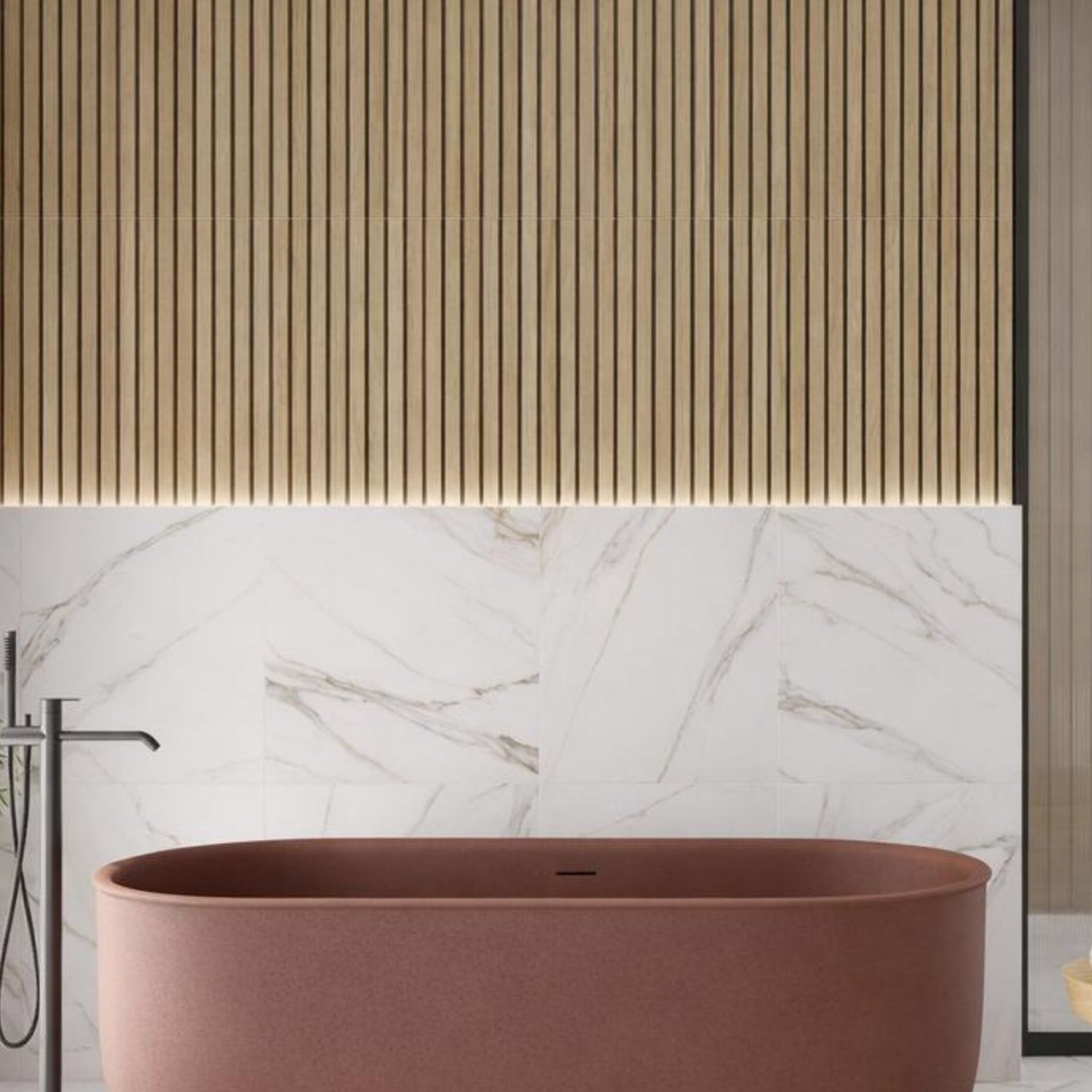 modern bathroom with a brown freestanding bathtub, white marble with silver and gold veining on wall, and wooden accents.