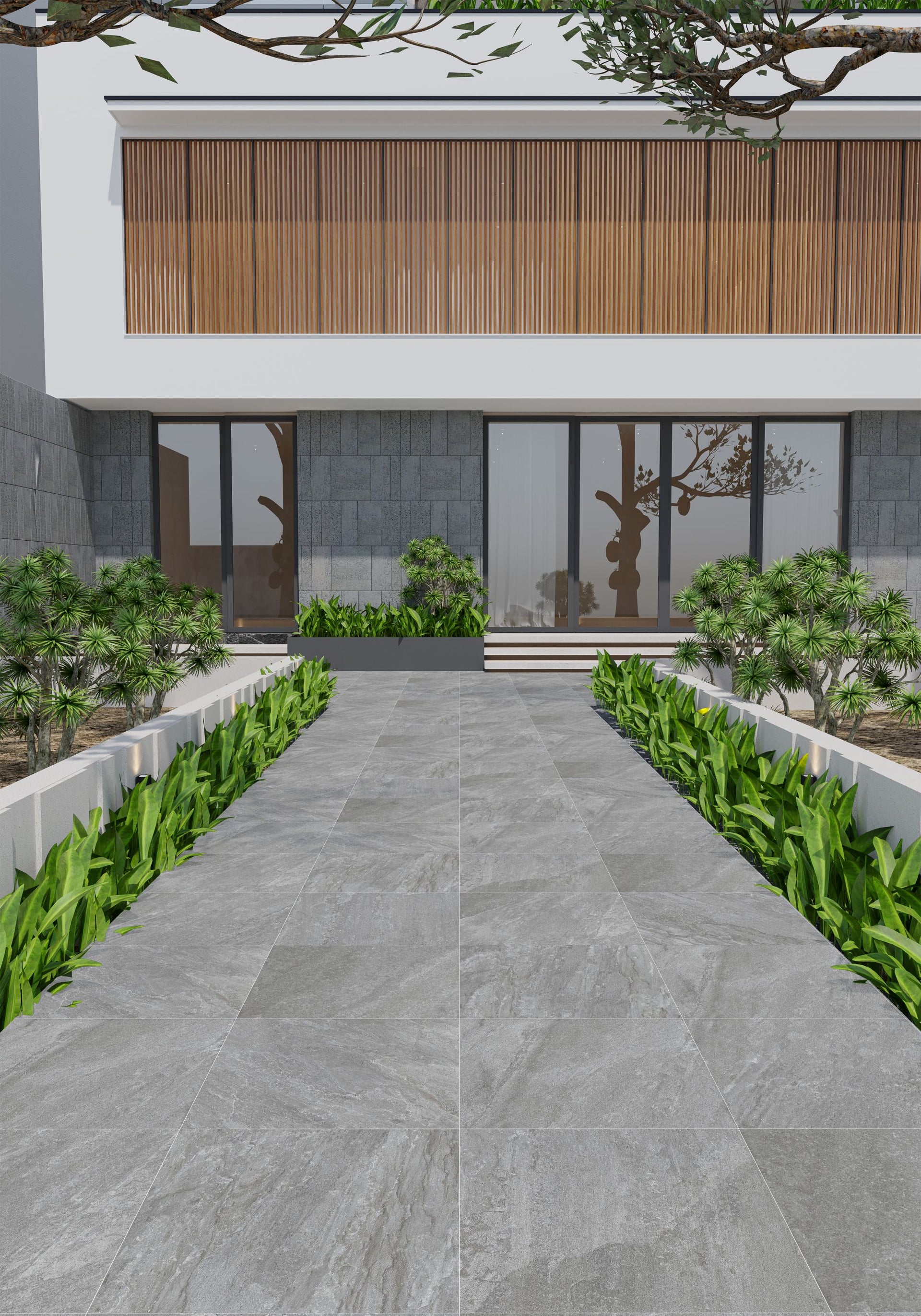 Modern building facade with a gray tiled pathway and greenery