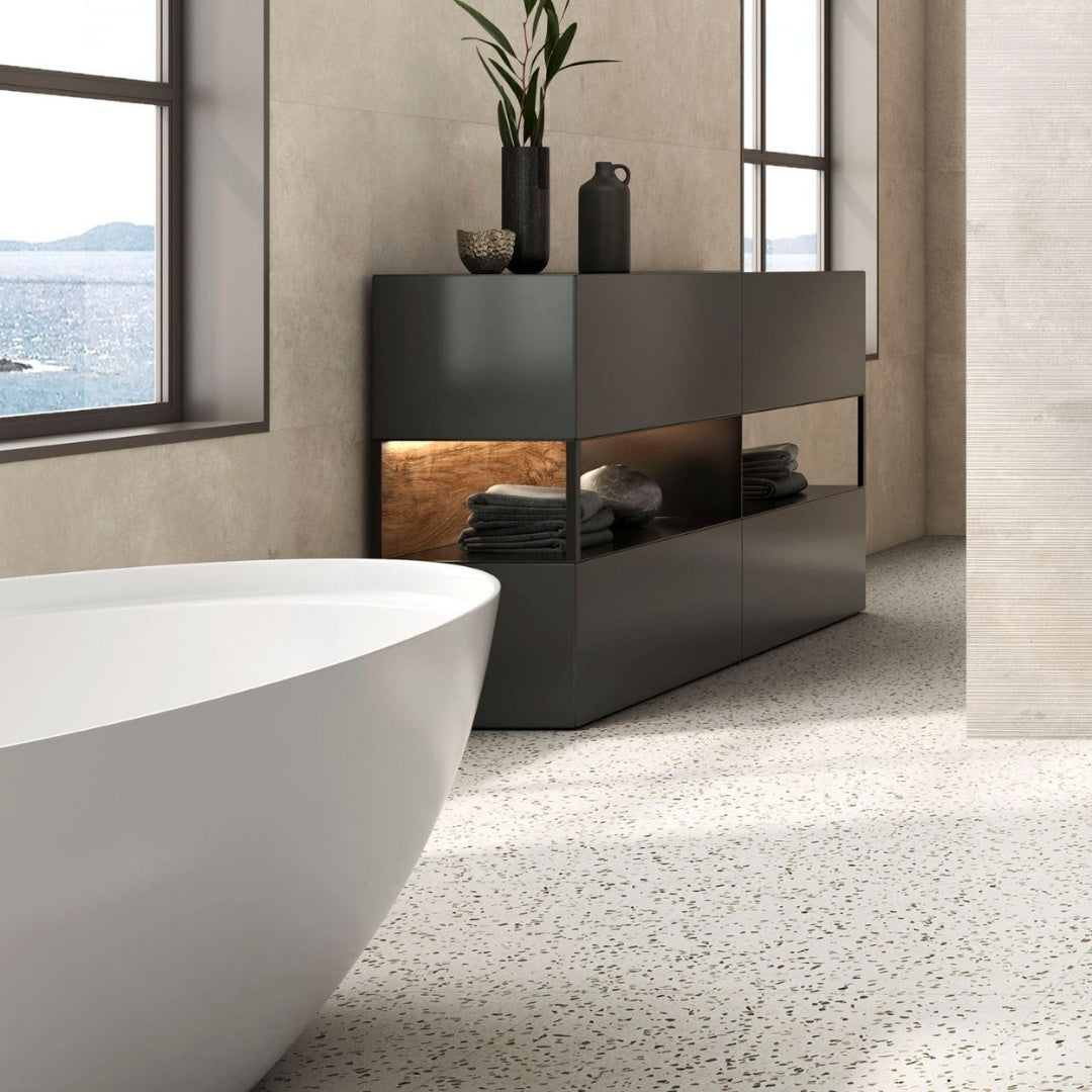 Modern bathroom with a freestanding bathtub on a terrazzo tile