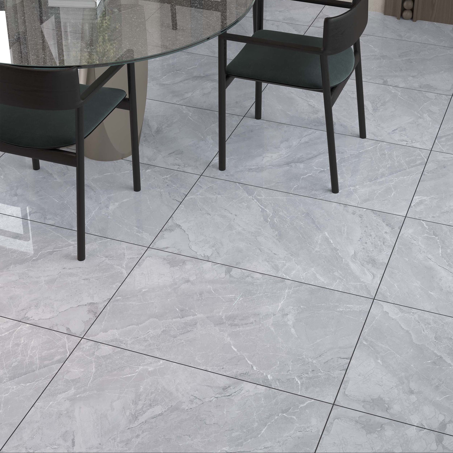 Gray tiled floor with a glass dining table and black chairs.