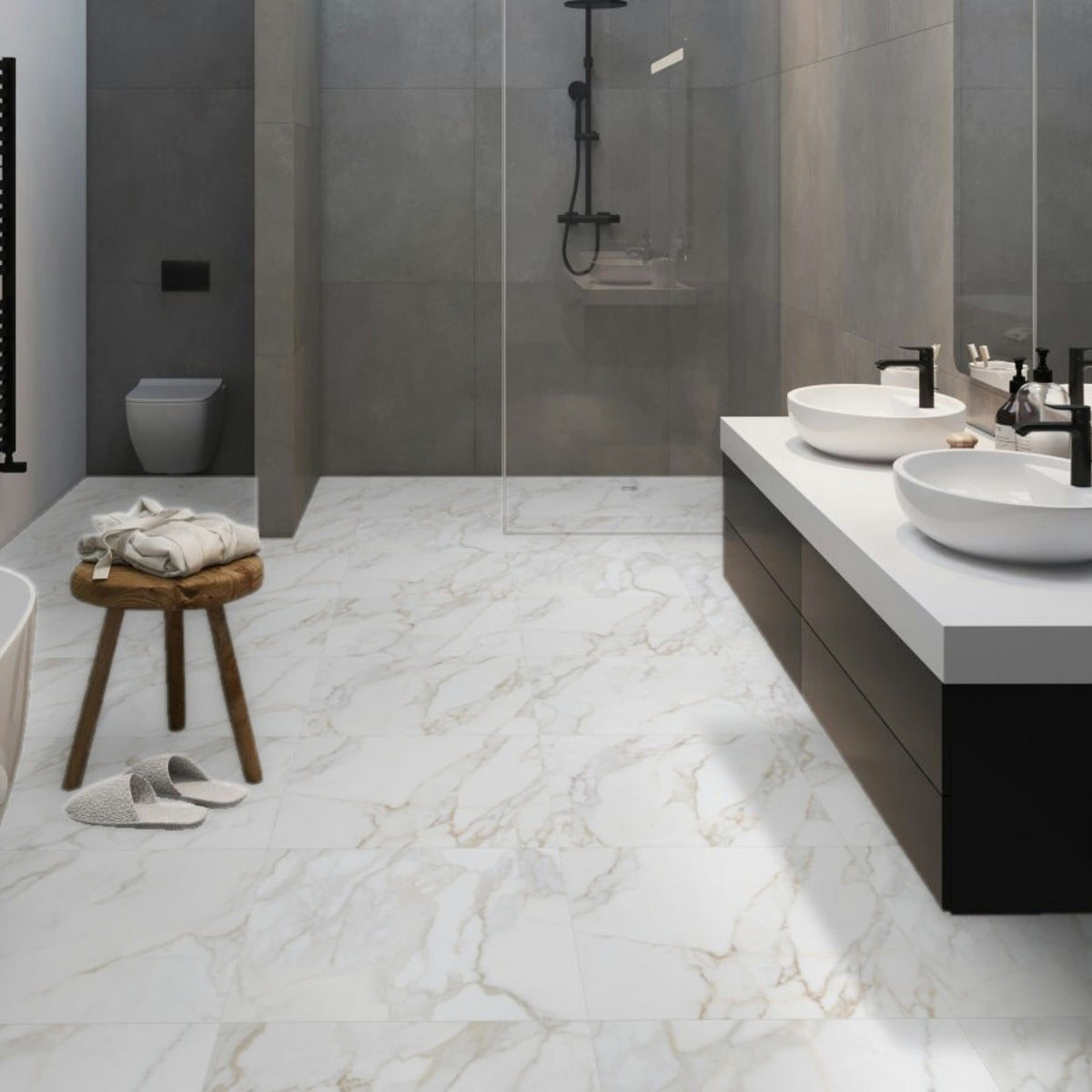 Modern bathroom with g Livrono grey and gold over white marble floor tiles, black vanity, and glass shower enclosure.