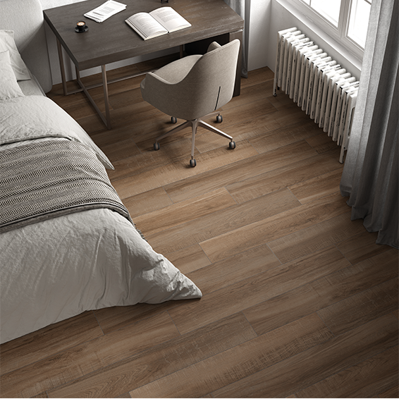 ordu oak wood-effect floor tiles in a bedroom with a work desk.