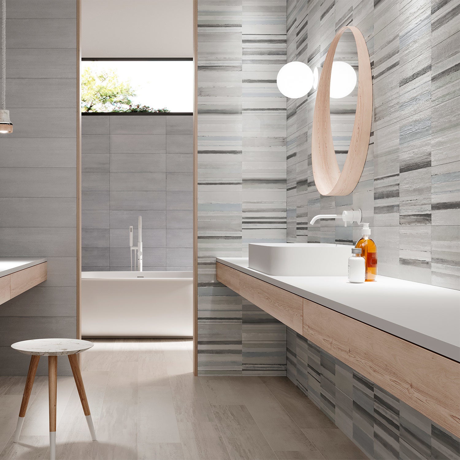 A contemporary bathroom setting featuring the Strand Decor striped patterned tile with a soft-brushed texture on the wall, alongside modern bathroom fixtures and a wooden vanity.