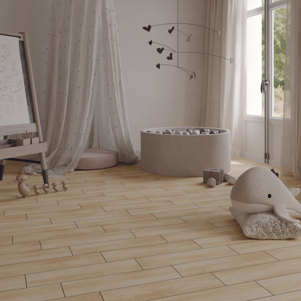 Children's room with wooden flooring, toys, and a large window.