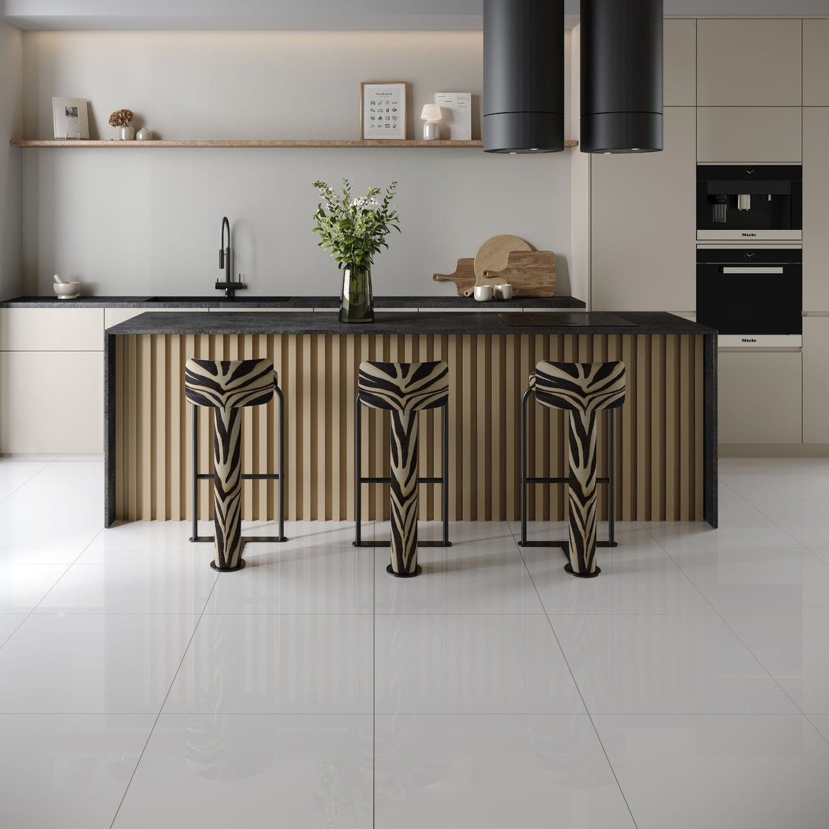 A modern kitchen with plain soft white polished square tiles, kitchen island with a wood slat front, black countertop, and three matching bar stools with a black-and-beige zebra-like patterned upholstery, set in a bright minimalist kitchen.