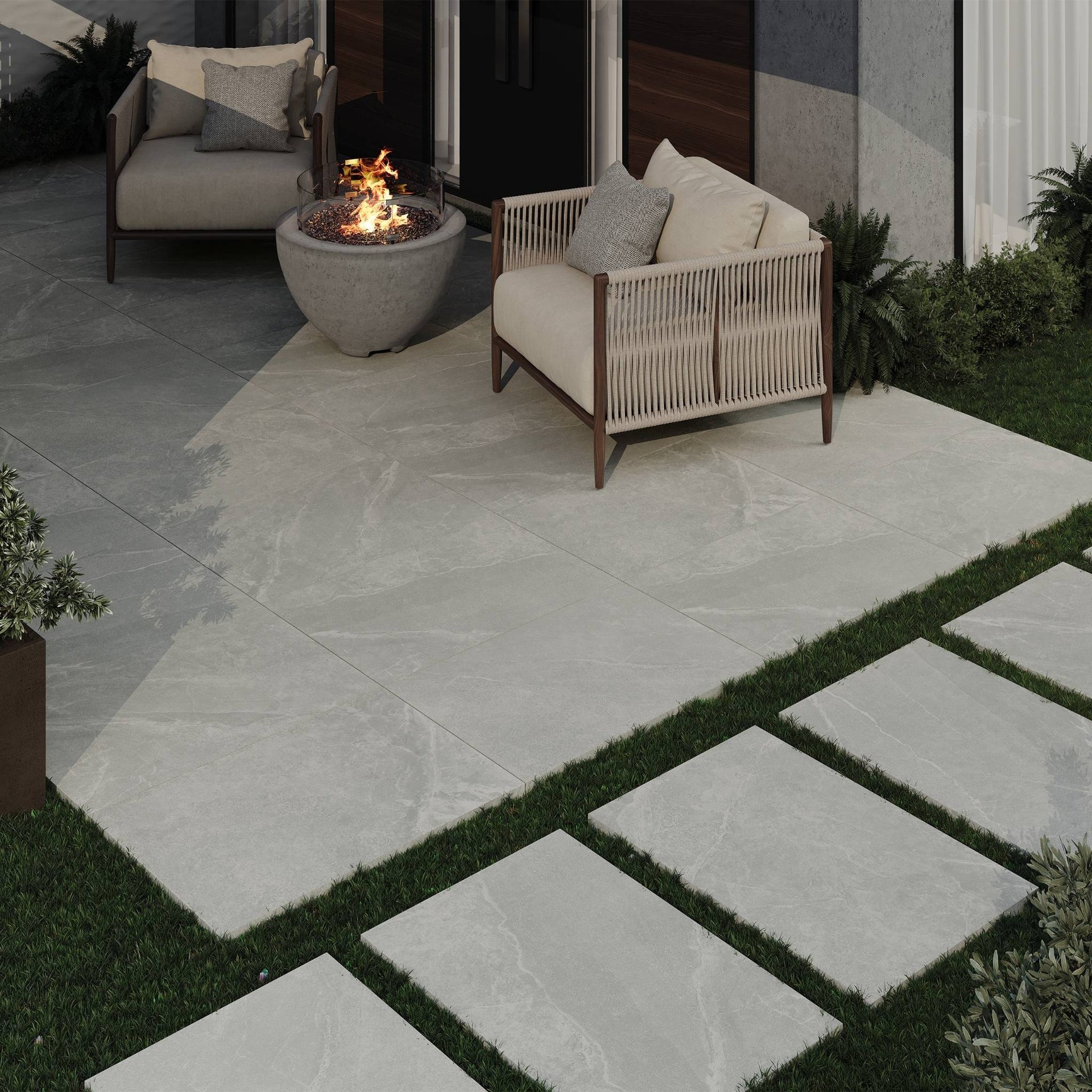Outdoor patio with fire pit, seating area, and Bradden grey stone-effect outdoor tiles