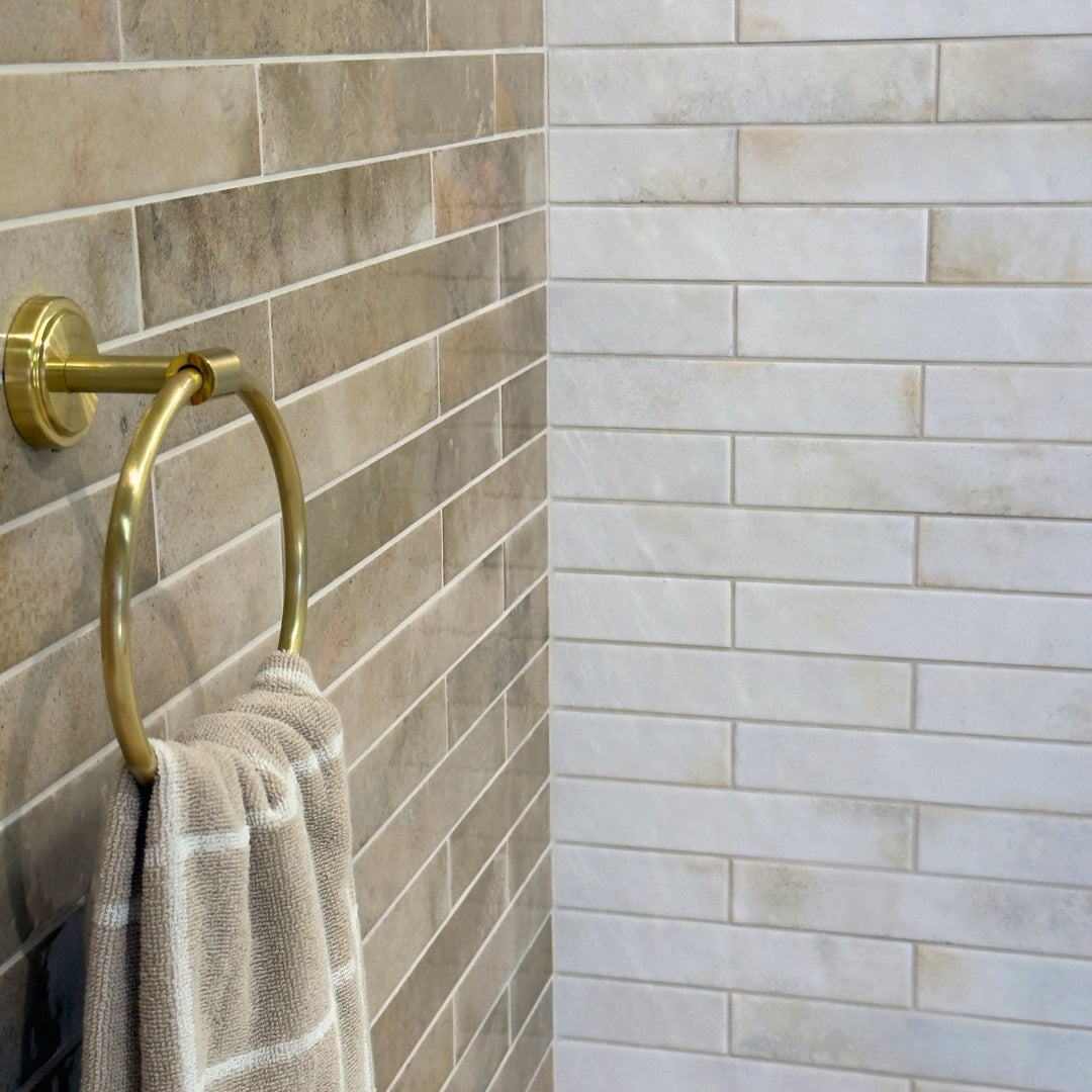 Burrington White and Almond beige tiles close up in a bathroom setting.