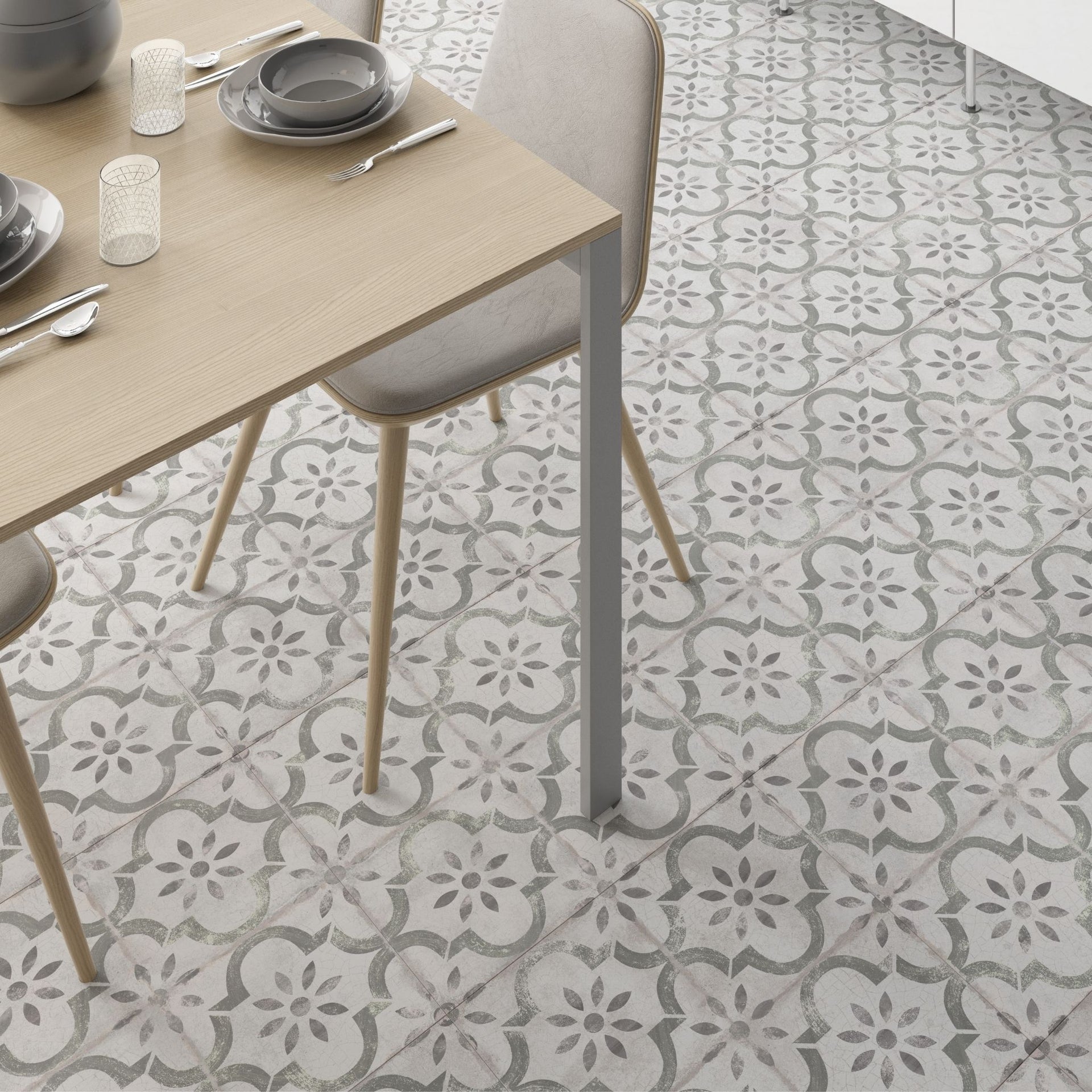 Wooden natural dining table with chairs on Classique green patterned floor tile