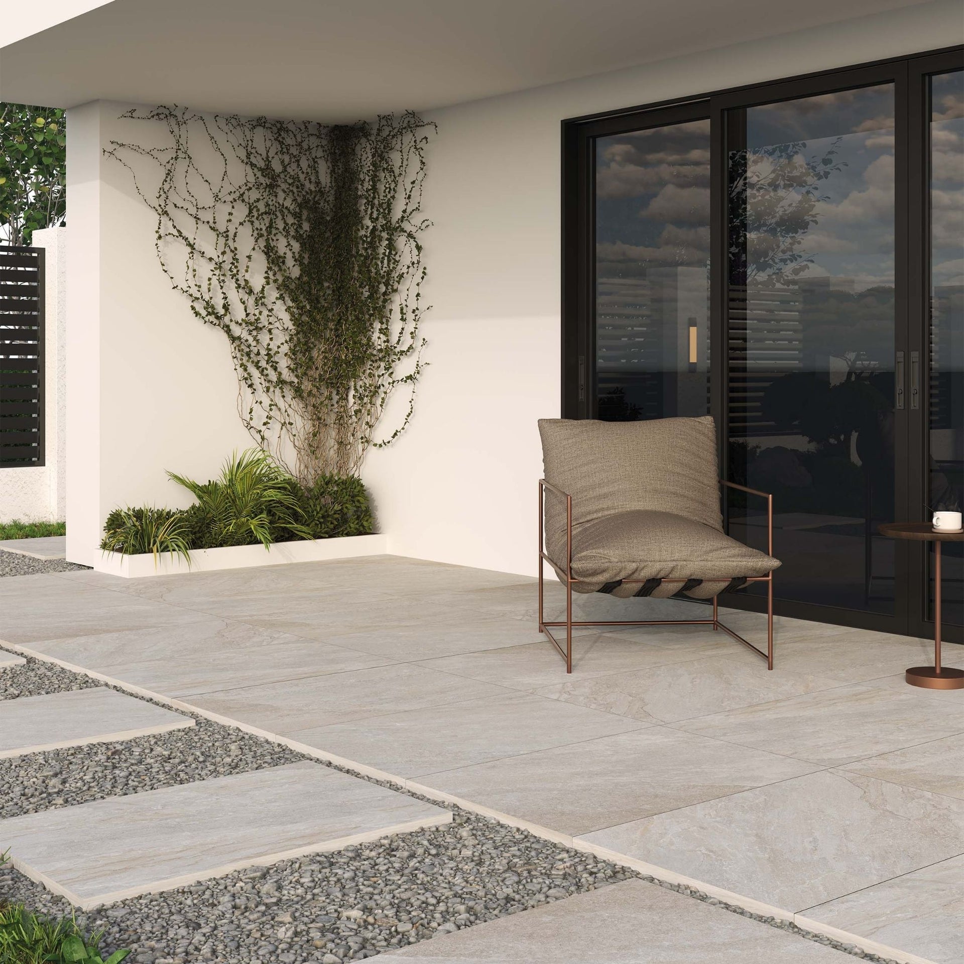 Modern outdoor patio with a chair and a view of a house exterior on Headley beige outdoor tile.