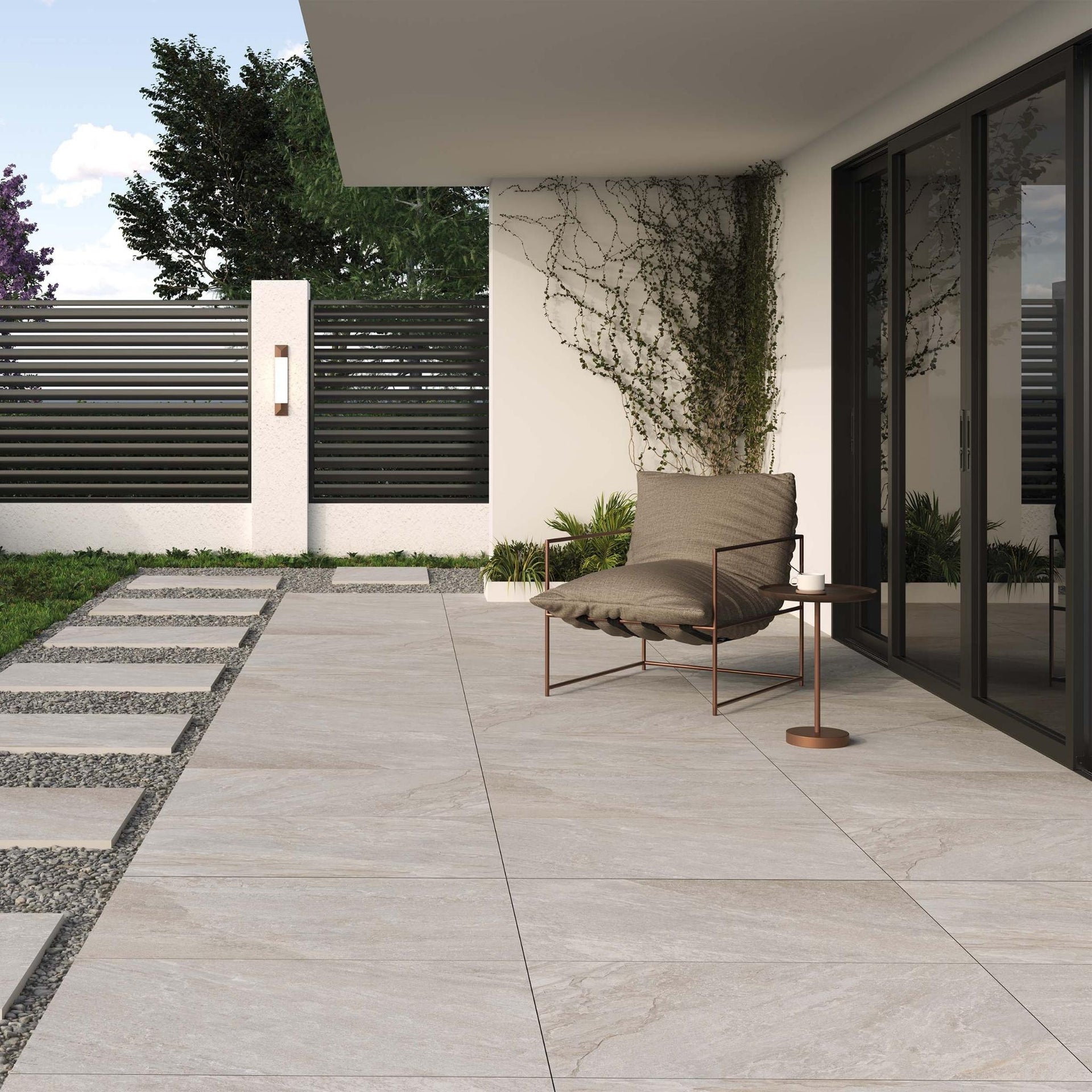 Modern outdoor patio with a chair and a view of a house exterior on Headley beige outdoor tile.