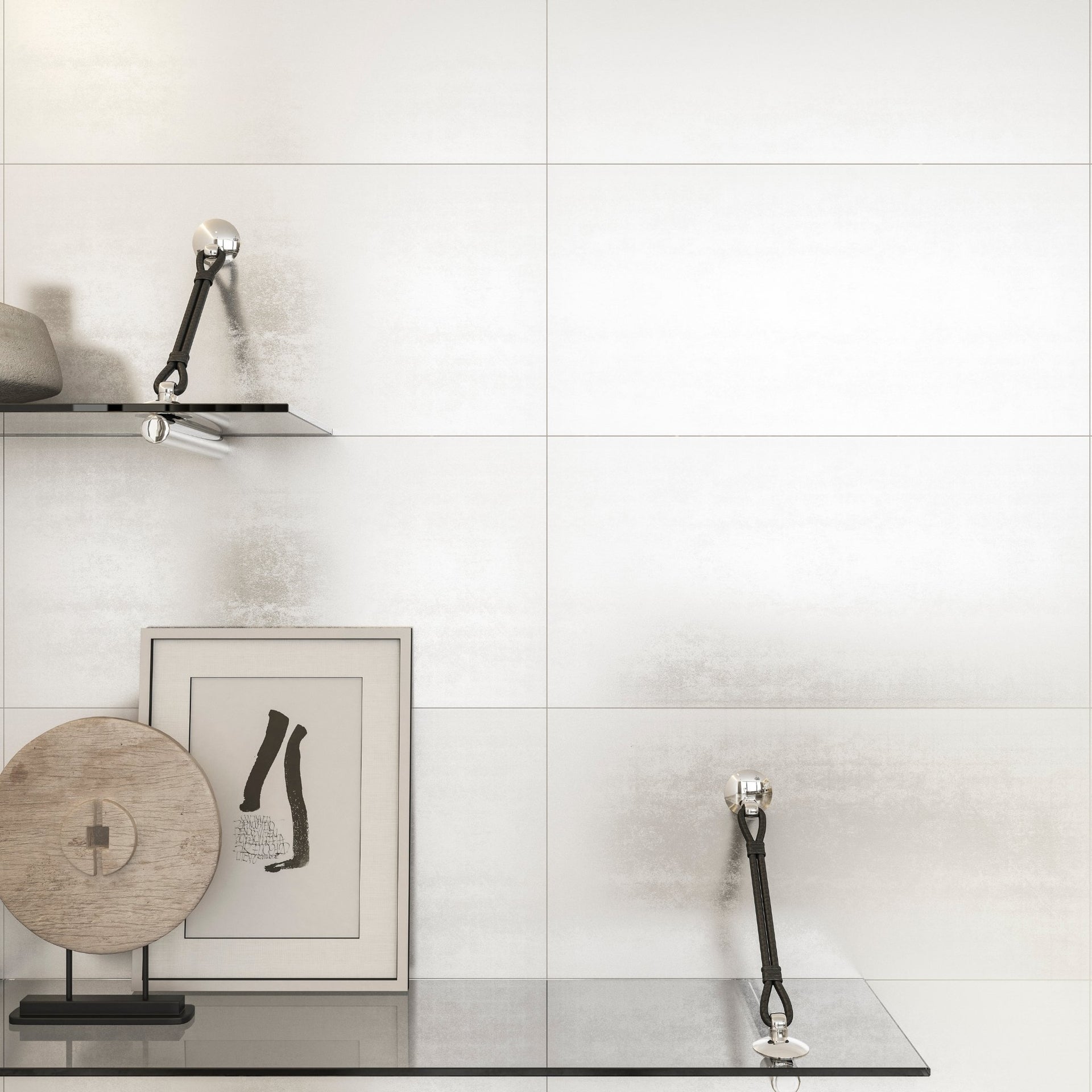 Modern interior design with abstract art and decorative items on a living room against a white, almost light grey metallic wall tiles.