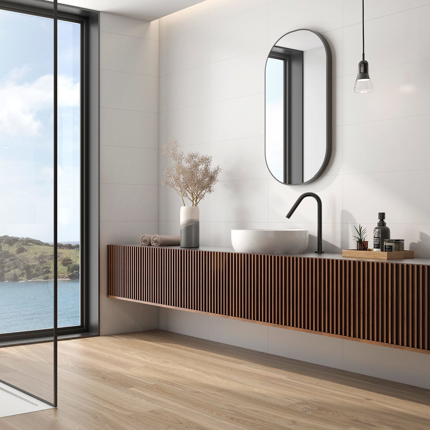 A modern bathroom setting featuring Lily White Matt tiles on the wall, with a white vanity, large mirror, and wooden elements.