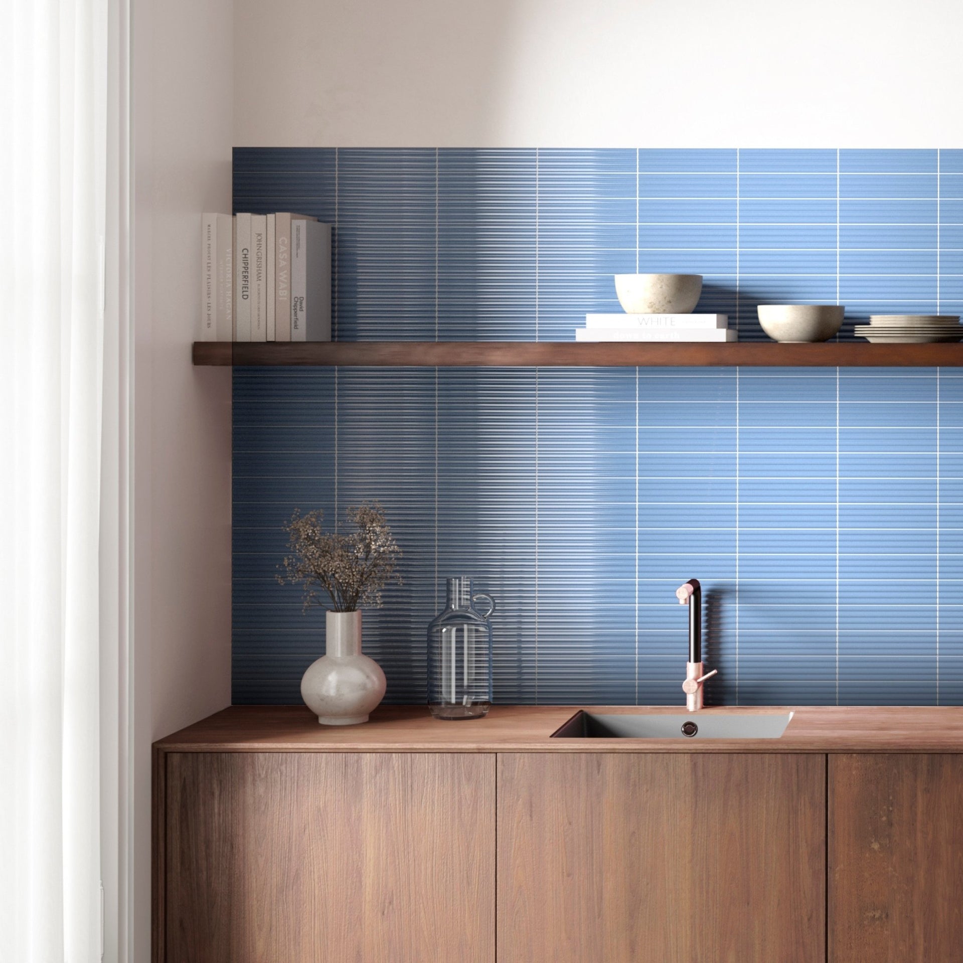 Modern kitchen with wooden cabinets, Moledo blue fluted tiled backsplash, and a shelf with books and bowls.

layout-kitchen