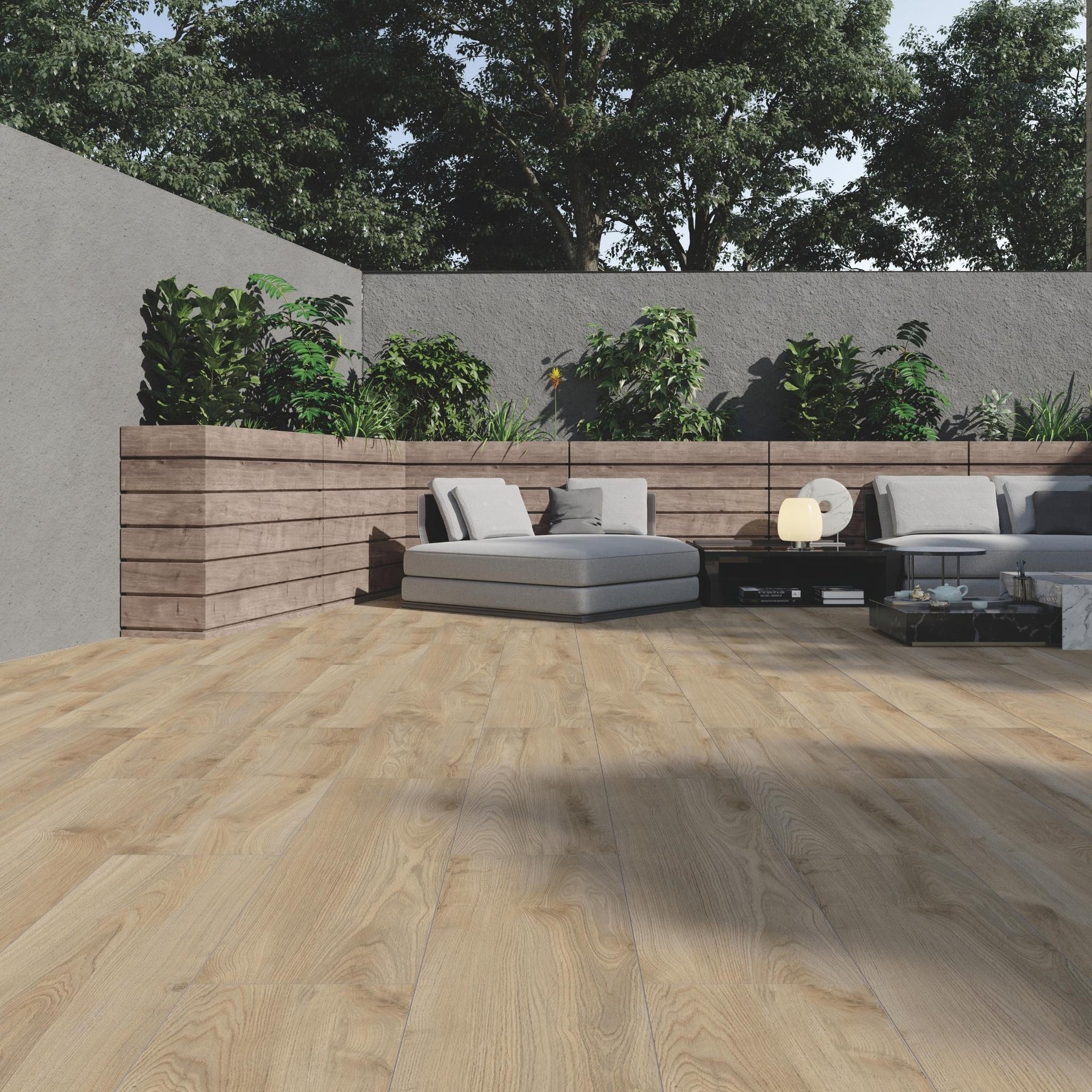 Outdoor patio with Nantucket brown wood effect flooring, greysofa, and plants.