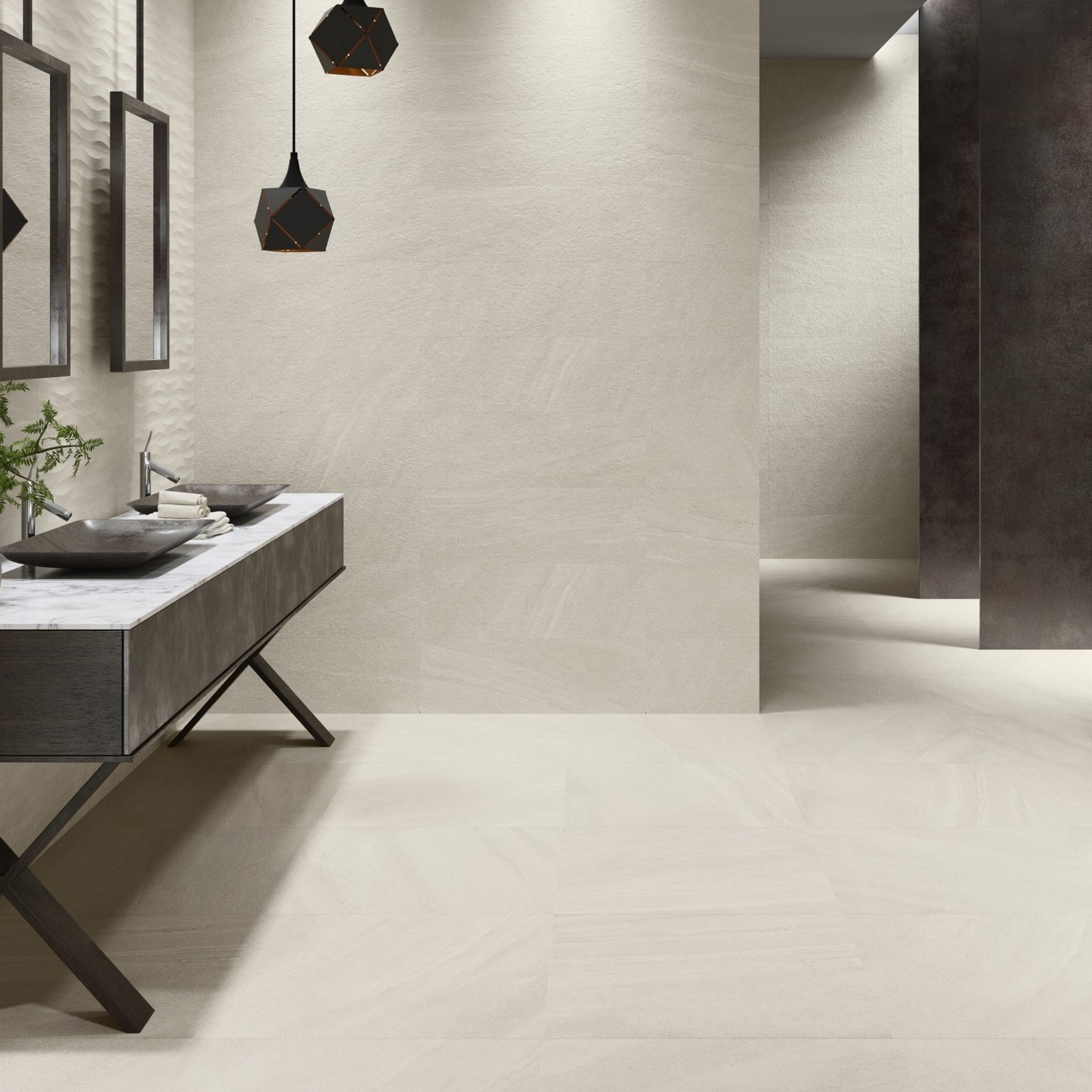 bathroom vanity with sink and mirrors on New York tiled cream stone effect wall and floors.