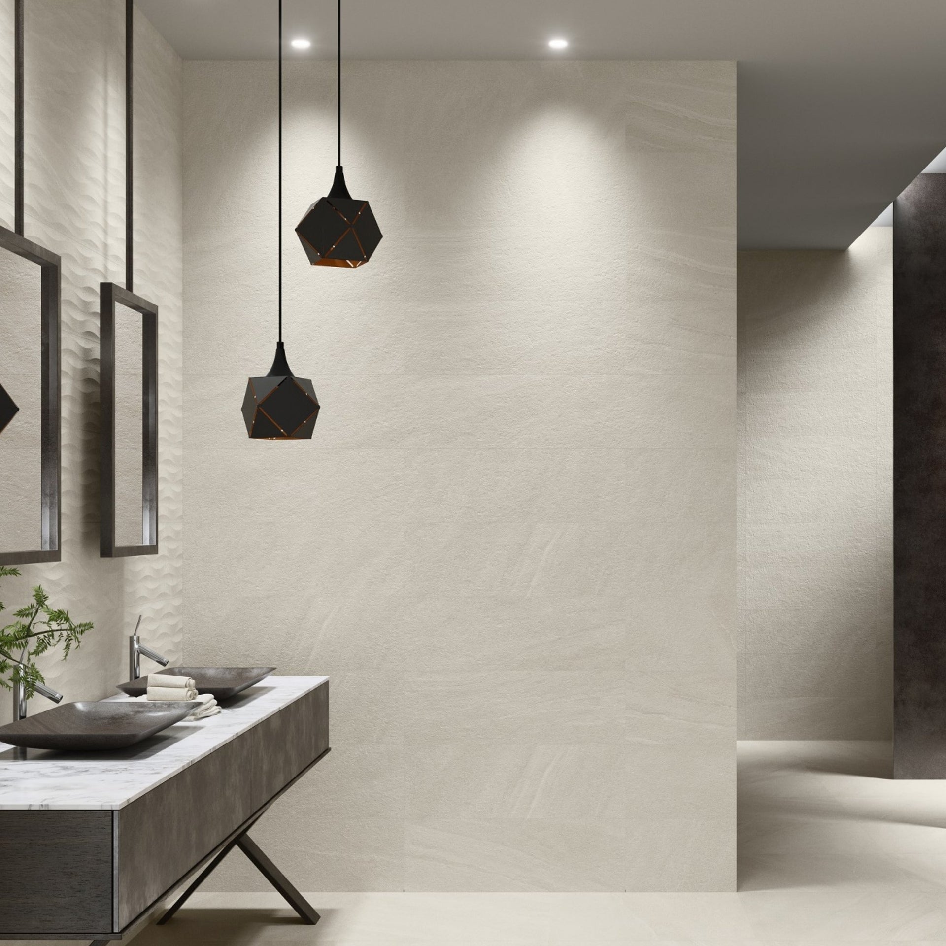 bathroom vanity with sink and mirrors on New York tiled cream stone effect wall and floors.