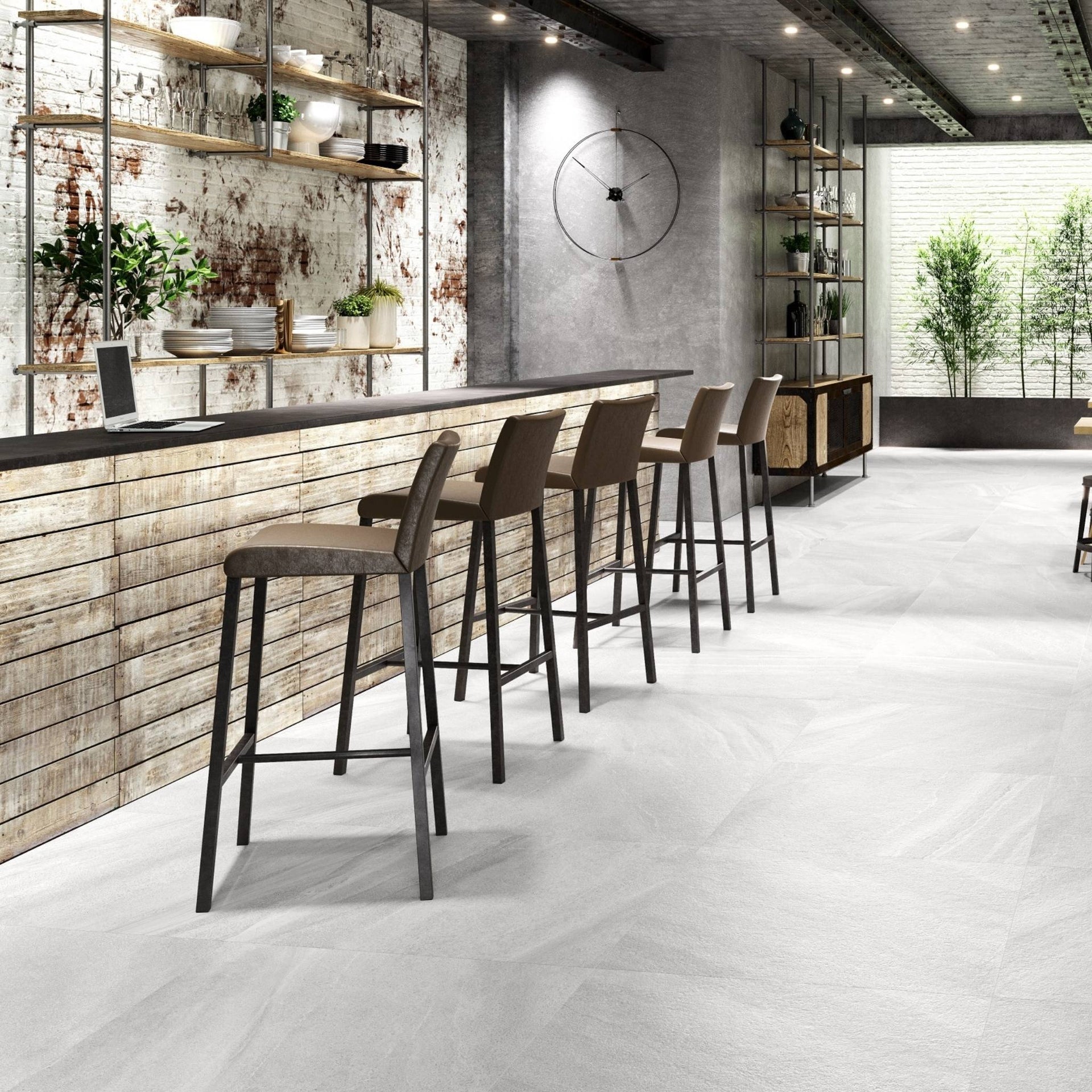 Industrial style kitchen with white stone effect floor tiles.