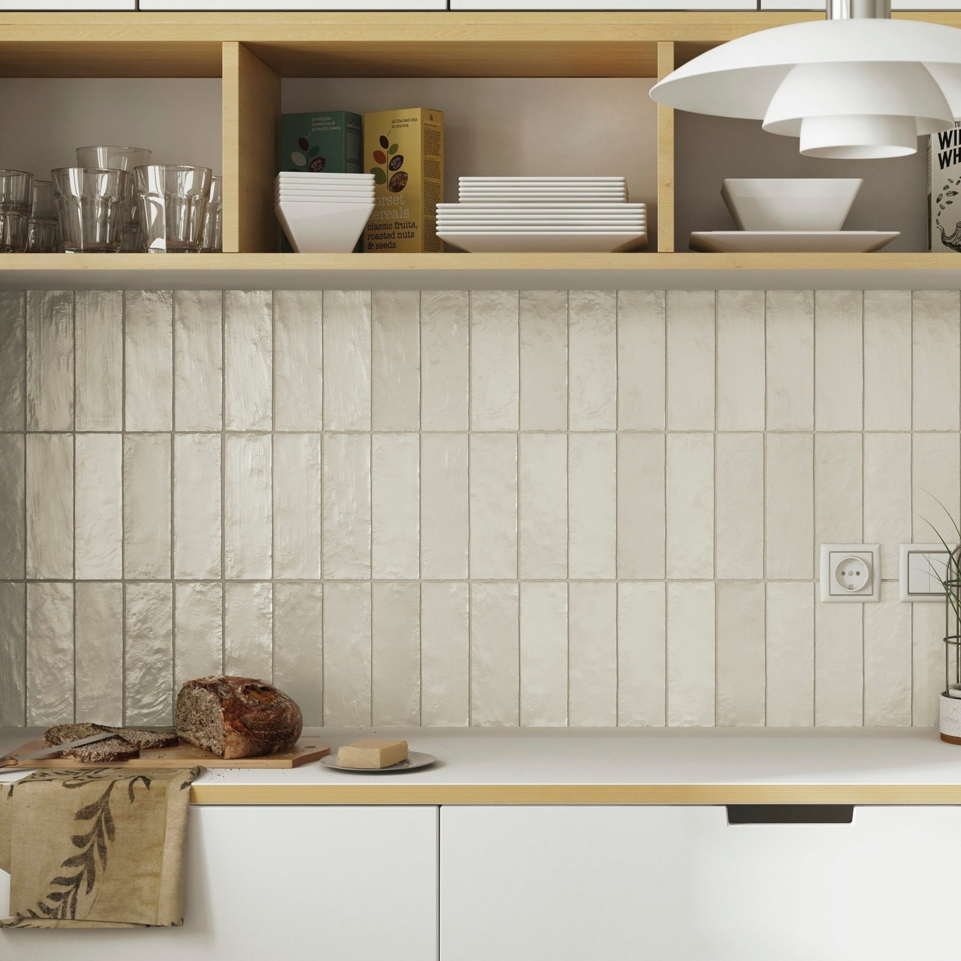 shimmer white gloss wall tiles in stacked vertical layout as a backsplash, on a white and wooden kitchen.