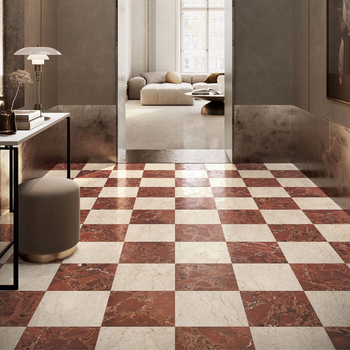 A checkered floor made of alternating warm Sillara reddish-brown and ivory marble-look tiles, shown in a modern interior hallway with a console table, stool, and an open doorway leading to a living room.

layout-hallway-tiles