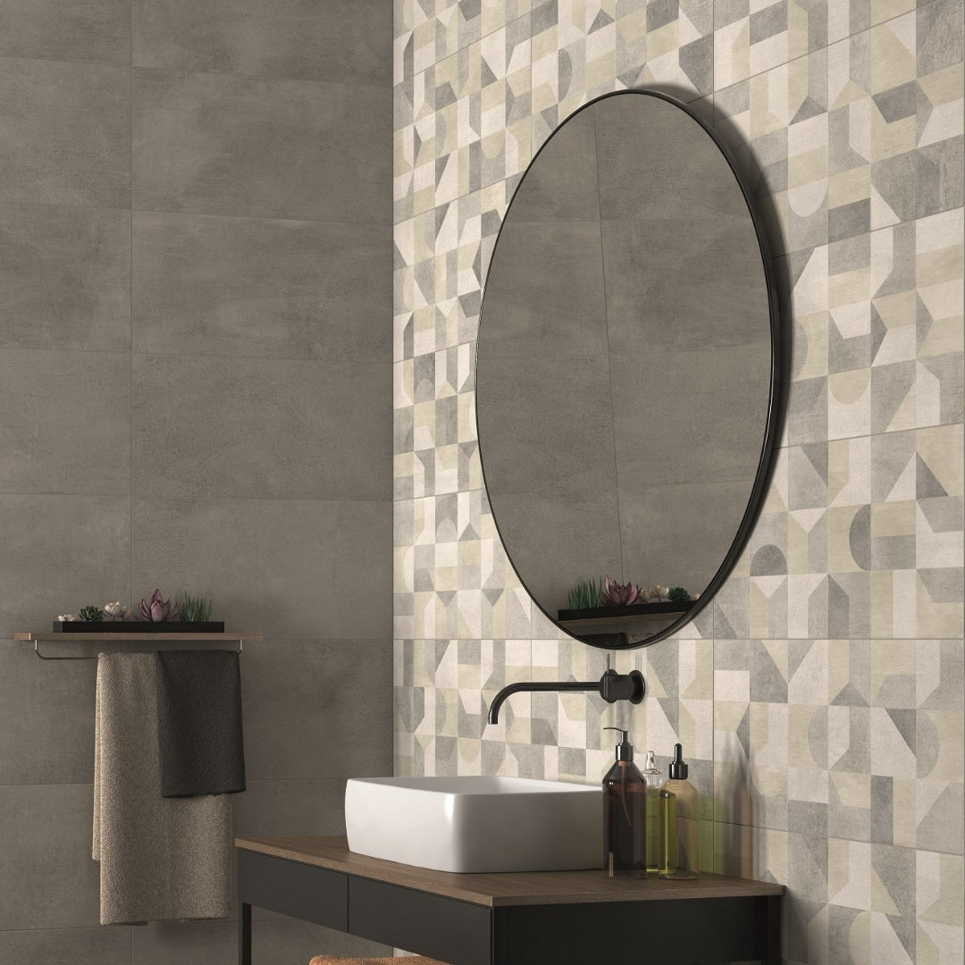 Bathroom vanity with round mirror and Thurlestone mix decor geometric tile pattern on the wall.

layout-bathroom