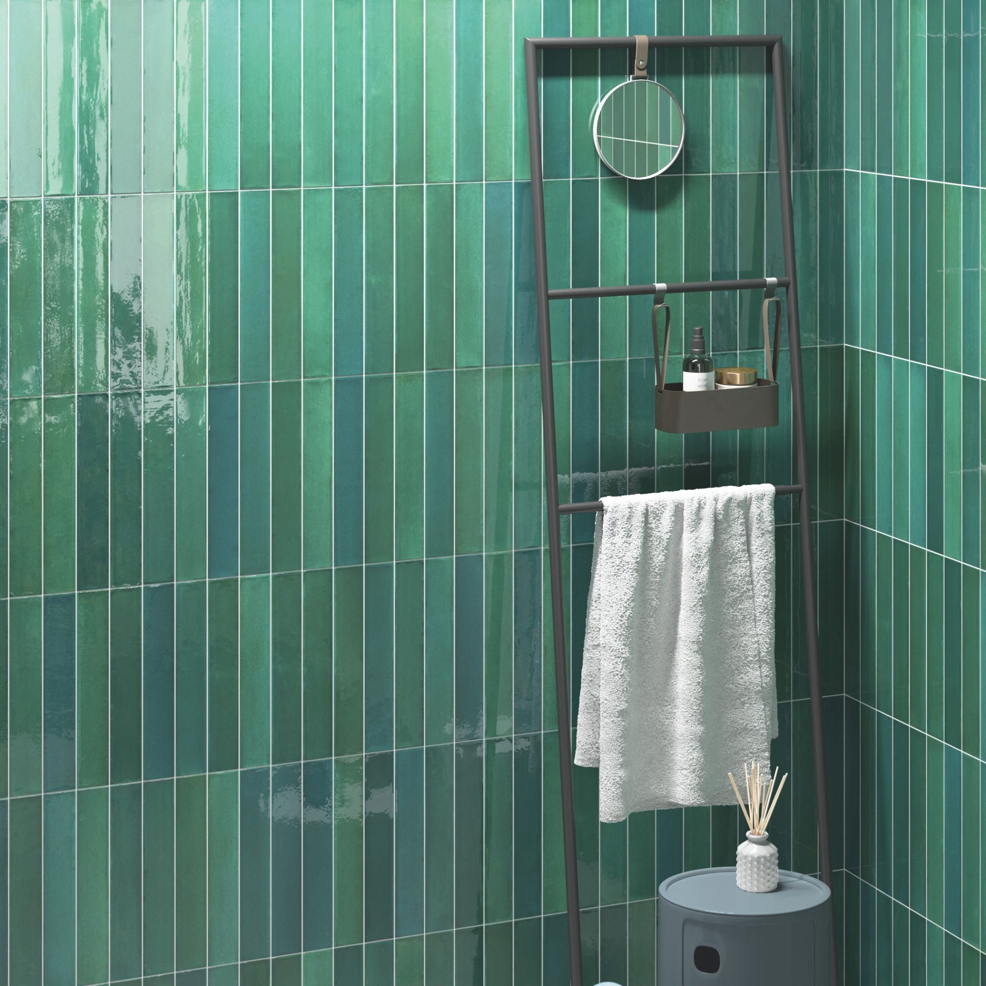 Bathroom ladder with towel and toiletries against a Tortosa green glossy tonal metro tiled wall