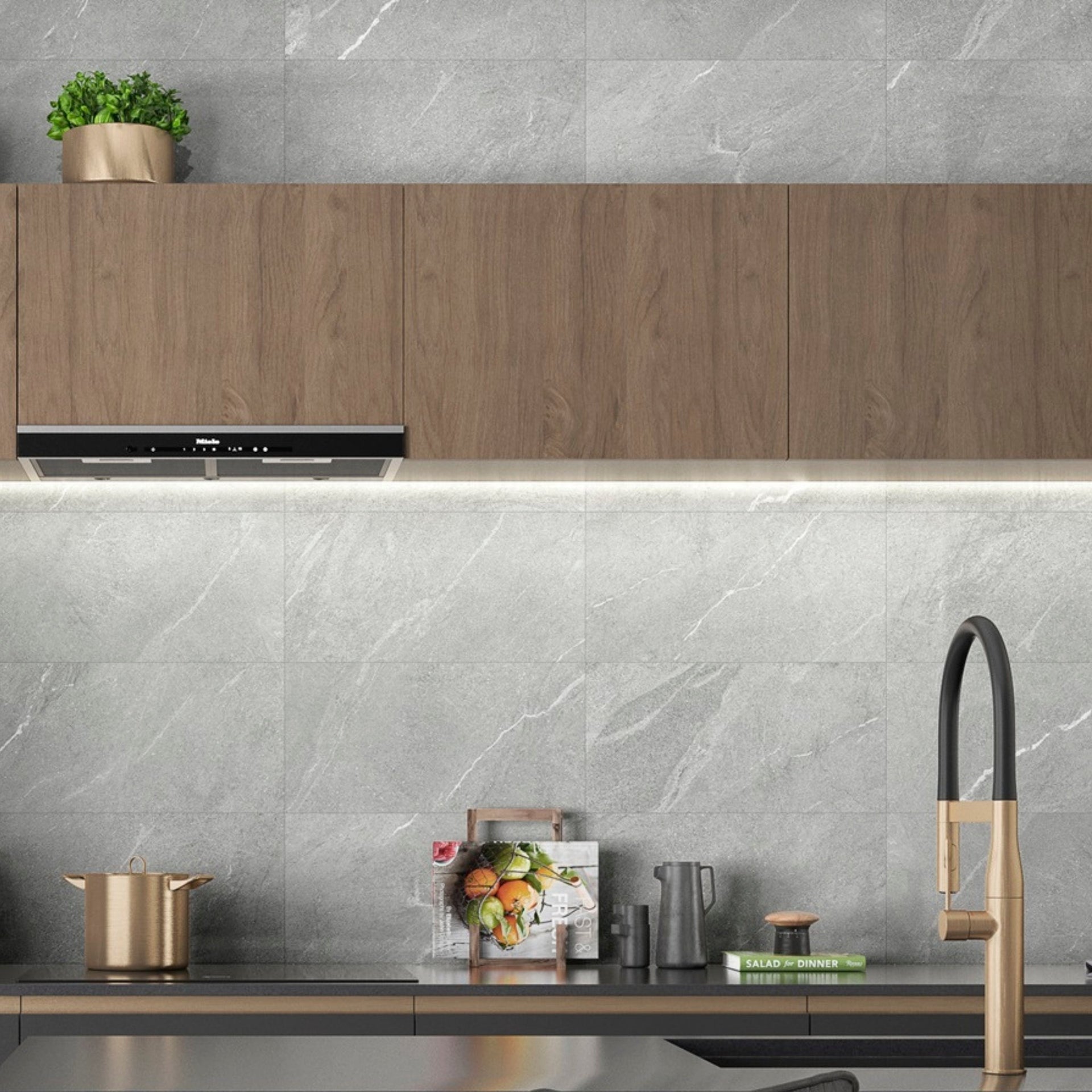 Glossy ash grey wall tiles with a stone effect pattern, installed in a modern kitchen setting, displaying a grey color tone.