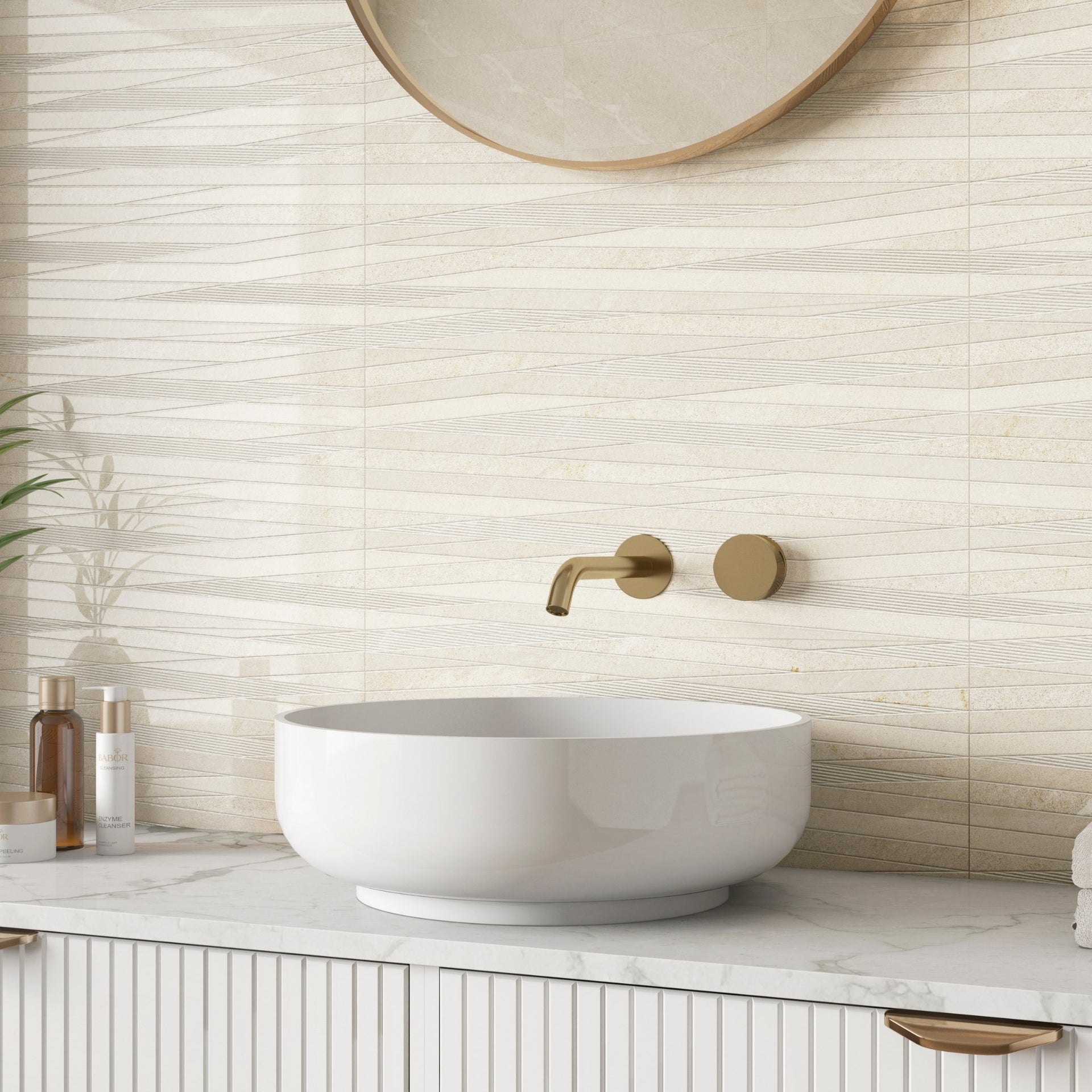 Bathroom with a white sink, gold faucet, and decorative beige glossy wave wall tiles