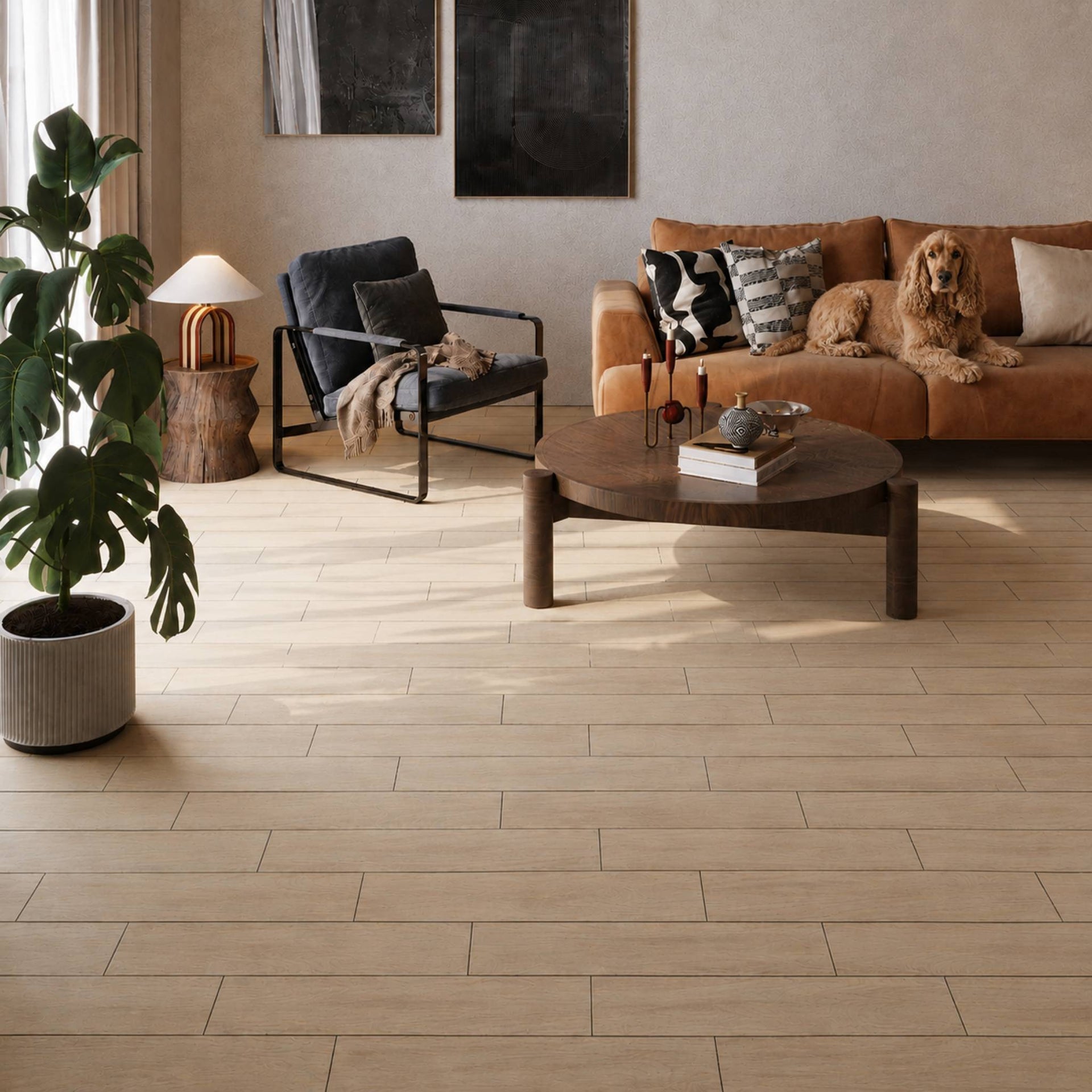 Modern living room with a wood-effect tile floor, brown pet dog on a sofa, coffee table, and wall art.